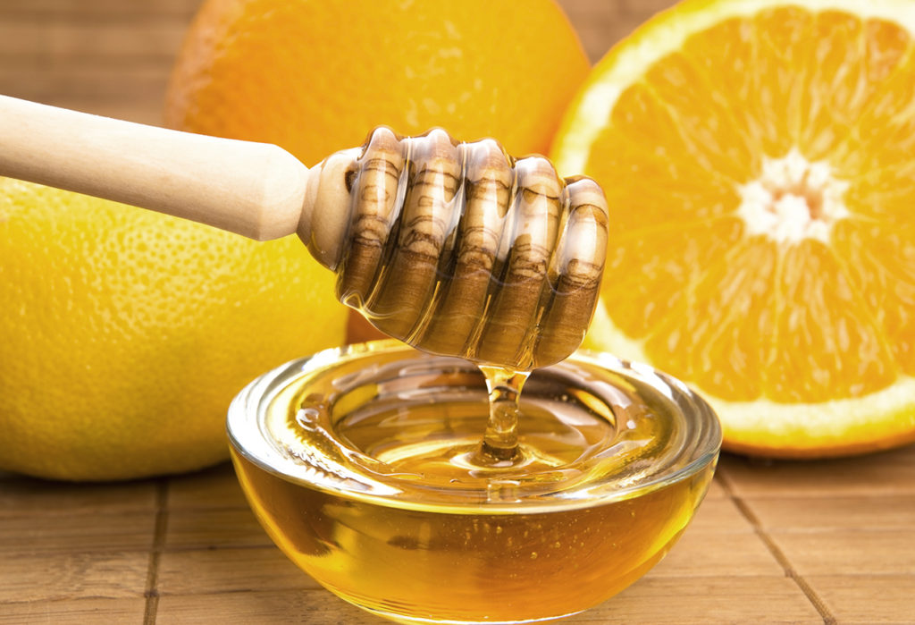 fresh honey with lemon and orange fruits